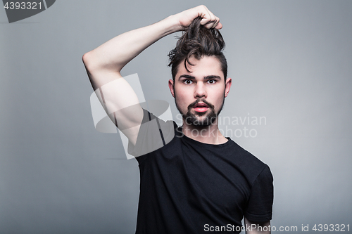 Image of Professional studio portrait of young handsome man