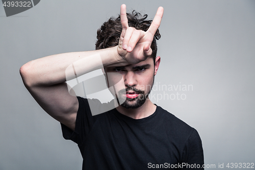 Image of Portrait of brutal bearded man with horns