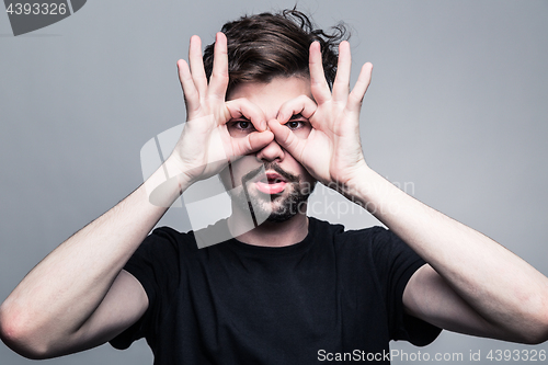 Image of Professional studio portrait of young handsome man