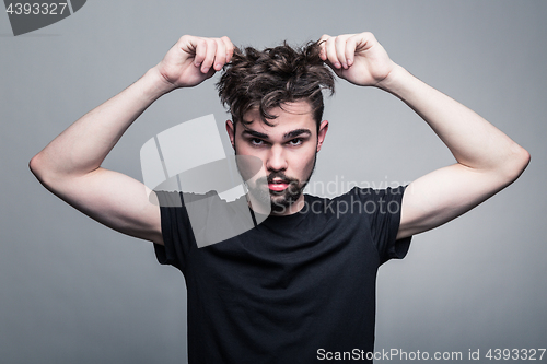 Image of Professional studio portrait of young handsome man