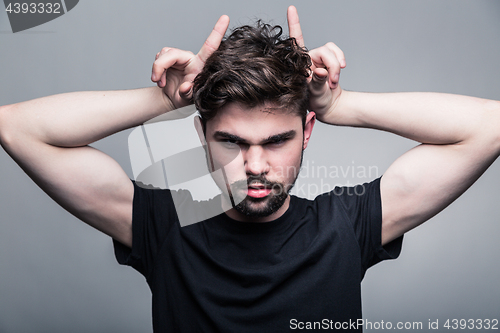 Image of Portrait of brutal bearded man with horns