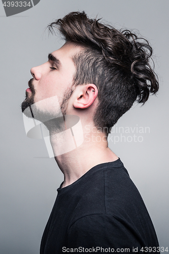 Image of Professional studio portrait of young handsome man