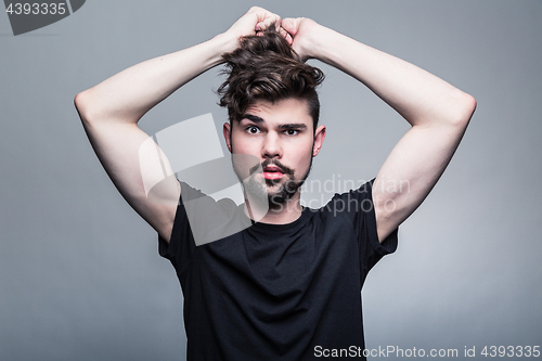 Image of Professional studio portrait of young handsome man