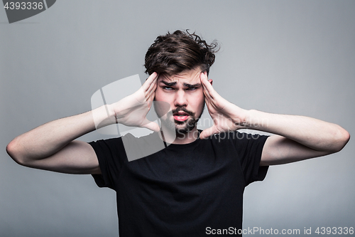 Image of Man feeling pain,  with gray background