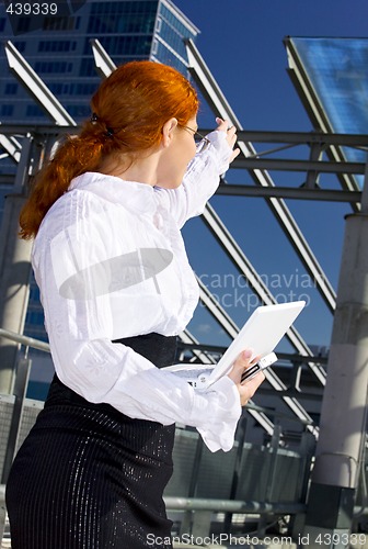 Image of confident businesswoman in the city