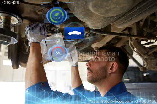 Image of mechanic man or smith repairing car at workshop