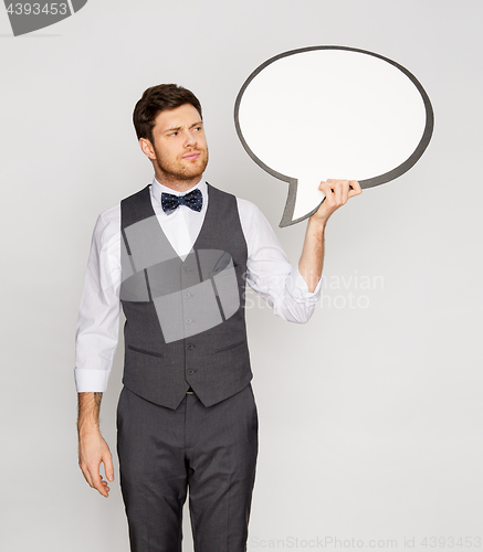 Image of man in suit holding blank text bubble banner