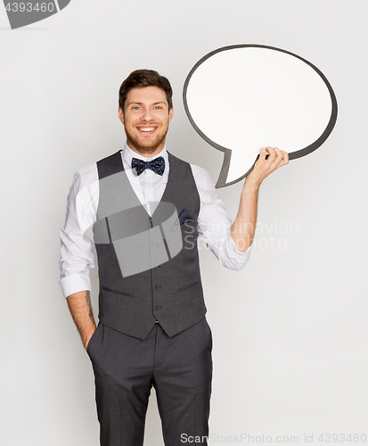 Image of happy man in suit holding blank text bubble banner