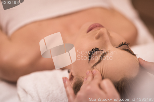 Image of woman receiving a head massage