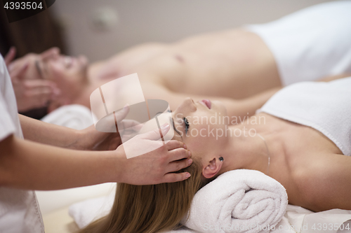 Image of couple enjoying head massage at the spa