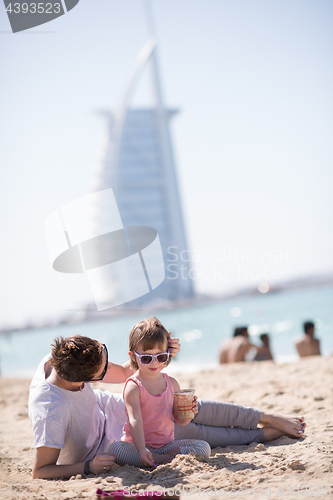 Image of Mom and daughter on the beach