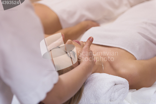 Image of woman receiving a head massage