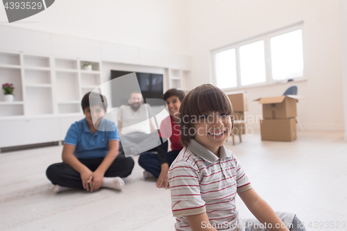 Image of portrait of happy young boys with their dad