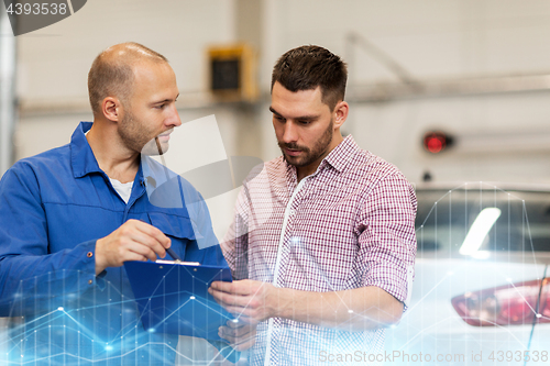 Image of auto mechanic with clipboard and man at car shop