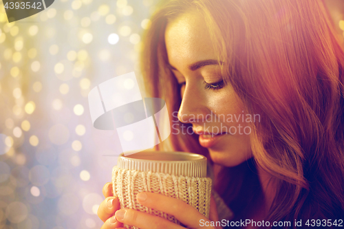 Image of close up of happy woman with tea or coffee cup