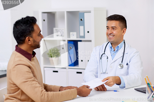 Image of doctor and male patient meeting at clinic