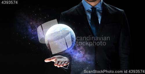 Image of close up of businessman with planet hologram