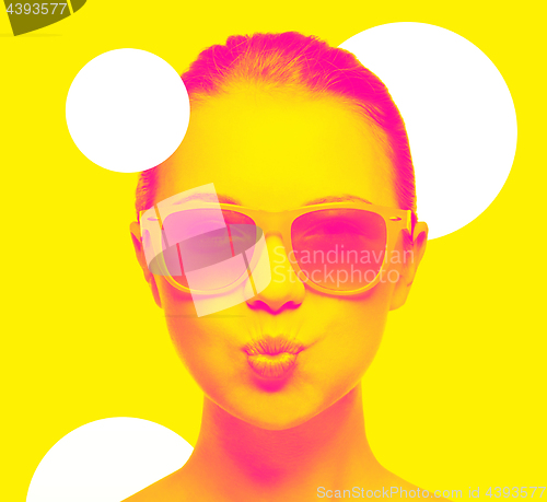 Image of girl in pink sunglasses blowing kiss
