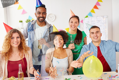 Image of happy team having fun at office party