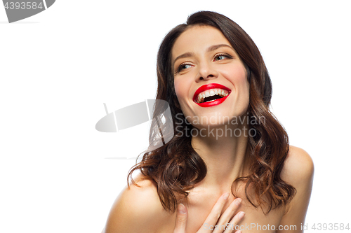 Image of beautiful laughing young woman with red lipstick