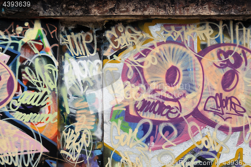 Image of grunge urban wall with messy graffiti tags