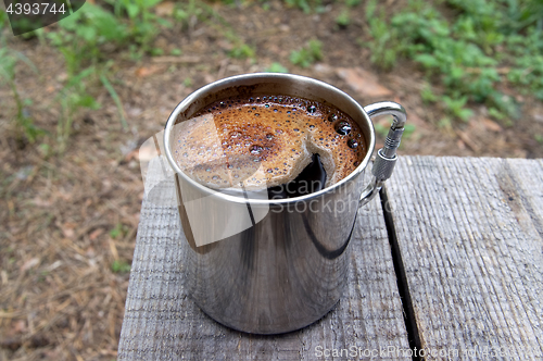 Image of Metal mug of coffee