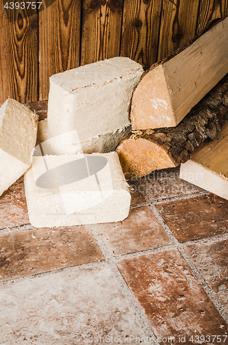 Image of Wood briquette and firewood, close-up