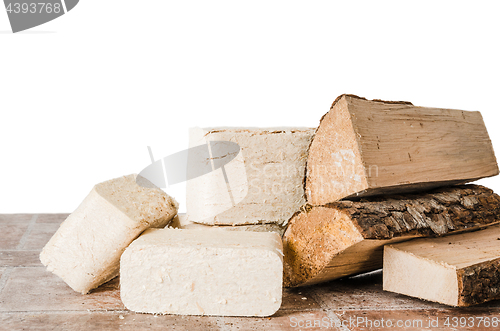 Image of Wood briquette and firewood, close-up