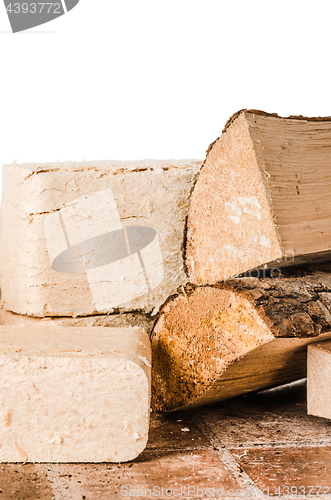 Image of Wood briquette and firewood, close-up