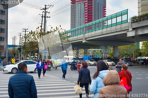 Image of People crossing road. Shanghai, China