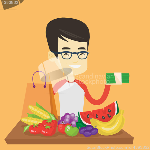 Image of Man standing at the table with shopping bag.