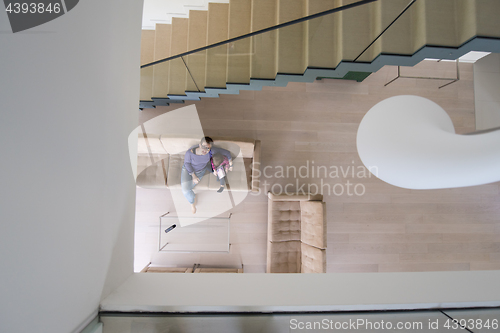 Image of mother and her cute little daughter are using a tablet top view