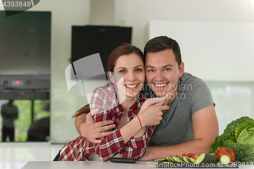 Image of Young couple in the kitchen