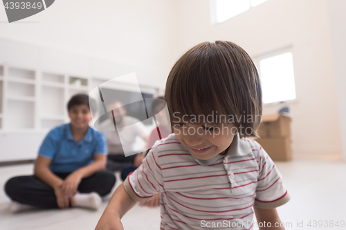 Image of portrait of happy young boys with their dad