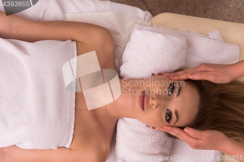 Image of woman receiving a head massage