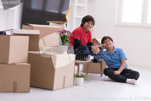 Image of boys with cardboard boxes around them