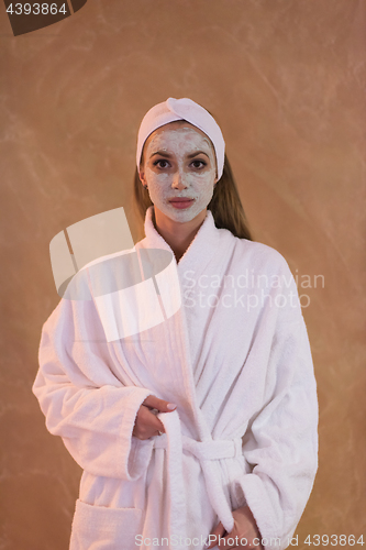 Image of Spa Woman applying Facial Mask