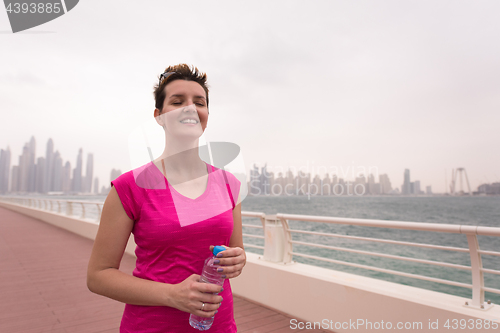 Image of young woman celebrating a successful training run