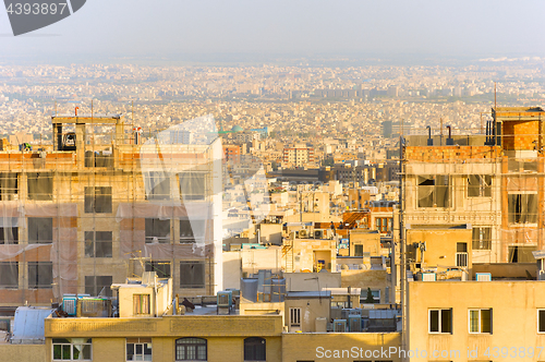 Image of Tehran cityscape at sunset. Iran