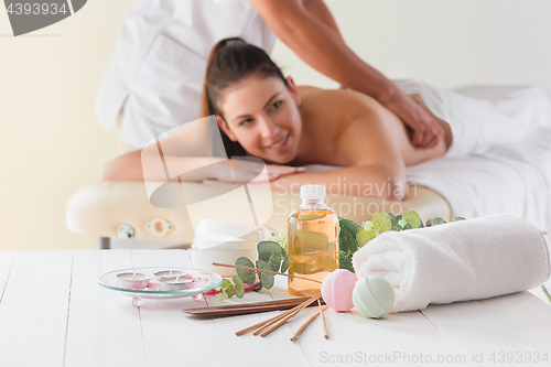 Image of picture of happy beautiful woman in massage salon