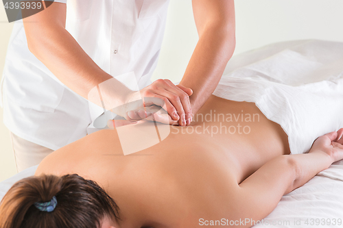 Image of The picture of beautiful woman in massage salon