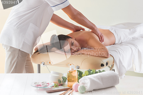 Image of The picture of beautiful woman in massage salon