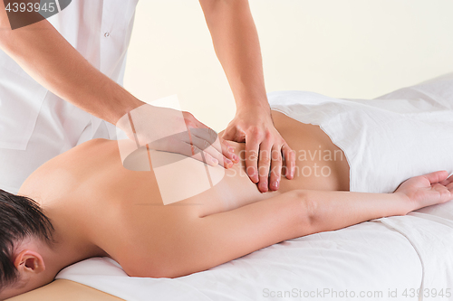 Image of The picture of beautiful woman in massage salon