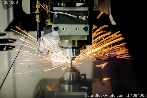 Image of CNC Laser cutting of metal, modern industrial technology.