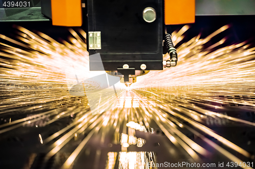 Image of CNC Laser cutting of metal, modern industrial technology.