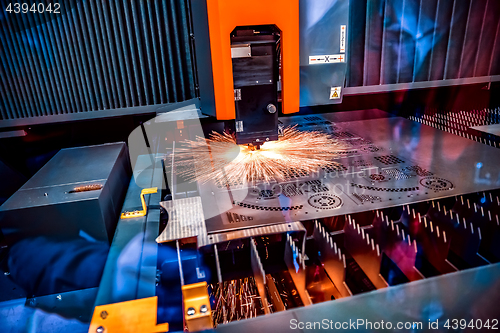 Image of CNC Laser cutting of metal, modern industrial technology.