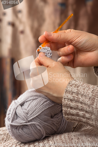 Image of hands knitting with crochet hook