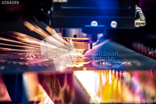 Image of CNC Laser cutting of metal, modern industrial technology.