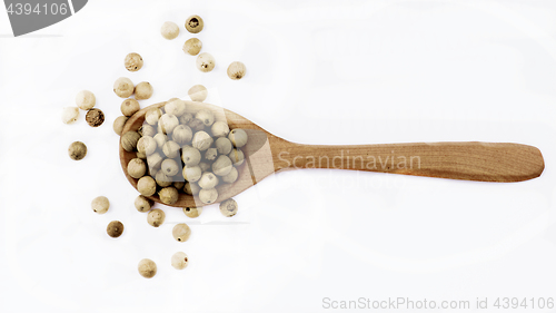 Image of White Pepper in Wooden Spoon