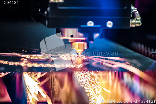 Image of CNC Laser cutting of metal, modern industrial technology.